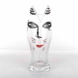 A COSTA BODA 'CAT' VASE the shaped clear body painted with the face of a cat, the rim shaped as