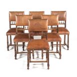 A SET OF SIX SPANISH STYLE VINYL AND FRUITWOOD SIDE CHAIRS each padded back above six spindles