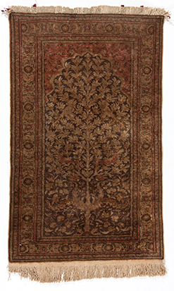 A TURKISH PRAYER RUG, MODERN the walnut field with an ascending flowering tree, rose spandrels