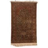 A TURKISH PRAYER RUG, MODERN the walnut field with an ascending flowering tree, rose spandrels