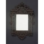 AN ART NOUVEAU STYLE WROUGHT-IRON MIRROR the rectangular plate within a moulded surround