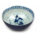 A CHINESE BLUE AND WHITE BOWL, QING DYNASTY, 19TH CENTURY rising from a short raised foot into a