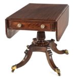 A REGENCY MAHOGANY PEMBROKE TABLE the hinged rounded rectangular top above a pair of opposing frieze