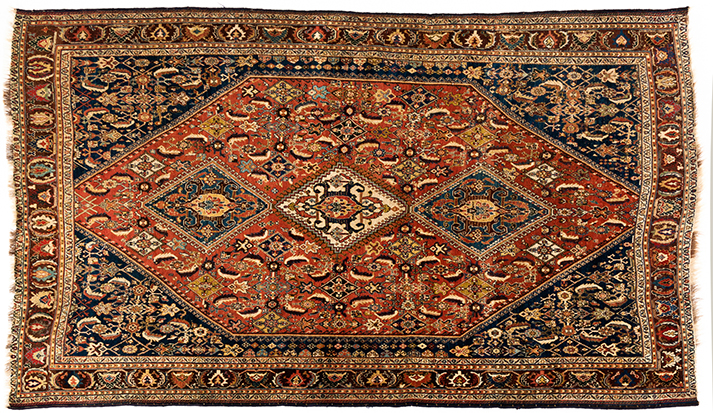 A QASHQAI RUG, SOUTH WEST PERSIA, CIRCA 1920 the madder-red field with three diamond pole medallions