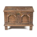 AN ENGLISH OAK CHEST, 19TH CENTURY the hinged rectangular top enclosing a compartment, panelled
