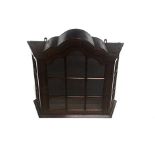 A DUTCH MAHOGANY WALL CUPBOARD, 19TH CENTURY the gabled pediment above a cottage-pane glazed door