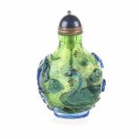 A CHINESE BLUE OVERLAY PEKING GLASS SNUFF BOTTLE the gold flecked green body carved with