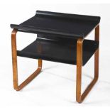 A BLACK LACQUER AND BEECH MODEL 915 TABLE DESIGNED BY ALVAR AALTO FOR FINMAR LTD each curved shelf