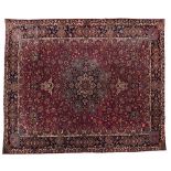 A MESHED CARPET, EAST PERSIA, MODERN the burgundy-red field with a dark-blue and ivory floral