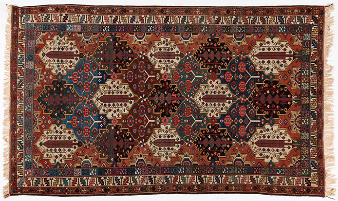 A BAKTIARI RUG, WEST PERSIA, CIRCA 1930 the field divided into multi-coloured stepped diamond