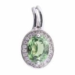 A TSAVORITE AND DIAMOND PENDANT centred with an oval mixed-cut tsavorite weighing 1.78cts, within