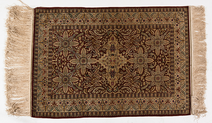 A HEREKE SILK RUG, TURKEY, MODERN the terracotta field with ivory floral medallion and six satellite