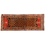 A MELAYER RUNNER, PERSIA, CIRCA 1920 the black field with an overall orange boteh pattern, red