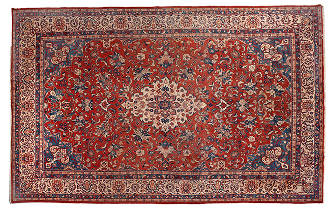 A MESHED CARPET, EAST PERSIA, MODERN the red field with an ivory floral medallion, blue spandrels