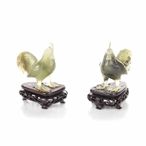 A PAIR OF CHINESE JADEITE 'ROOSTER' CARVINGS each standing with the head slightly cocked, the comb