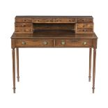 A MAHOGANY WRITING DESK, FIRST HALF 20TH CENTURY the rectangular moulded top surmounted by a gallery