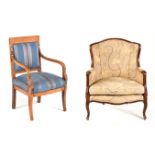 AN UPHOLSTERED ARMCHAIR the padded back and sides within a conforming moulded frame, loose seat