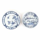 TWO CHINESE PORCELAIN BLUE AND WHITE PLATES one centred by a riverscape, panelled border pattern,