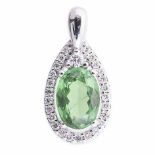 A TSAVORITE AND DIAMOND PENDANT centred with an oval mixed-cut tsavorite weighing 1.68cts, within