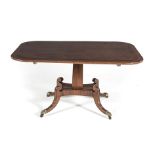 A REGENCY MAHOGANY BREAKFAST TABLE the rounded crossbanded rectangular top on a tapering square-