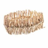 A 14CT GOLD BRACELET composed of textured linear links, resembling coral, impressed 585,