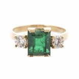 AN EMERALD AND DIAMOND RING centred with an emerald-cut emerald weighing approximately 1.96cts,