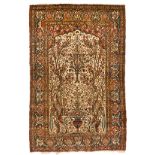 AN ISPAHAN PRAYER RUG, PERSIA, CIRCA 1930 the ivory mehrab with an ascending flower and tree design,