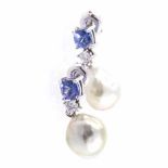 A PAIR OF TANZANITE DIAMOND AND SOUTH SEA PEARL PENDANT EARRINGS each surmount claw-set with a