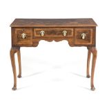 A WALNUT LOW BOY, 19TH CENTURY the rectangular crossbanded top above a central frieze drawer flanked