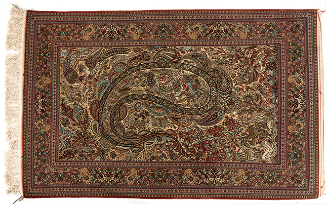 A QUM SILK RUG, PERSIA, MODERN the ivory field with large polychrome leaf design, all with