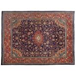 A SAROUK CARPET, WEST PERSIA, MODERN the deep indigo-blue field with a red floral star medallion,