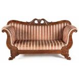 A DUTCH WALNUT SETTEE, 19TH CENTURY the curved top rail centred by a pierced and foliate-carved