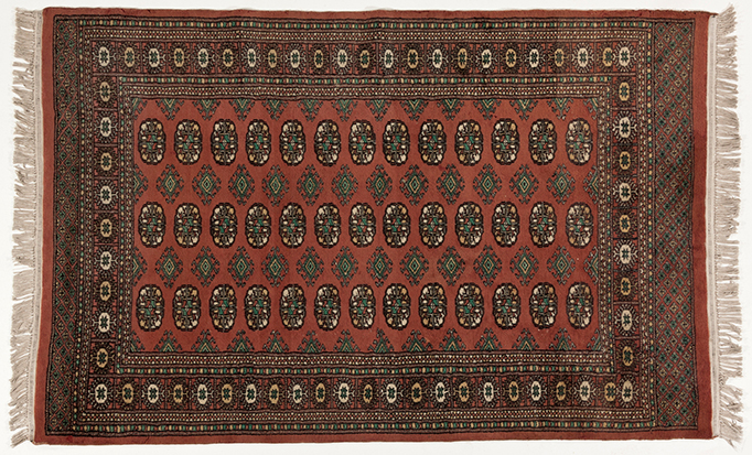 A PAKISTANI RUG, MODERN the rose field with three rows of guls and side guls depicted in ivory,