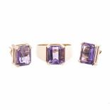 A PAIR OF AMETHYST EAR STUDS each claw-set with a rectangular step-cut amethyst weighing