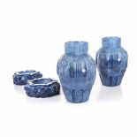 A PAIR OF DESNA CZECH OPAQUE BLUE GLASS VASES of hexagonal form moulded with alternating panels of