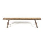 A DUTCH OAK BENCH the plank seat on curved legs, each joined by an H-stretcher 195cm long