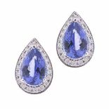 A PAIR OF TANZANITE AND DIAMOND EAR STUDS each centred with a pear-shaped tanzanite weighing 2.34cts