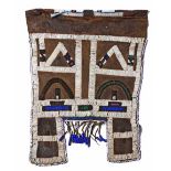 AN NDEBELE MAPOTO, SECOND HALF 20TH CENTURY the leather backing applied with beadwork 59cm high,
