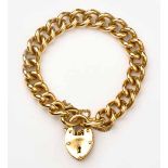 AN 18CT GOLD BRACELET composed of curb-link chain, with heart padlock clasp, with safety chain,