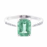 AN EMERALD AND DIAMOND RING claw-set with an emerald-cut emerald weighing approximately 2.17cts, the