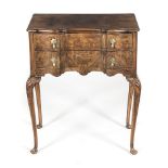 A QUEEN ANNE STYLE WALNUT LOW BOY the rectangular moulded top above a pair of conforming