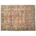AN INDO-PERSIAN CARPET, MODERN the pale-rose field with an overall design of palmetes, vines and