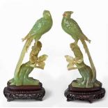 A PAIR OF CHINESE JADEITE 'PHEASANT' CARVINGS each long-tailed bird perched on a gnarled stump