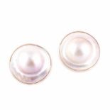 A PAIR OF MABÉ PEARL EAR STUDS each setting centred with a pink mabé pearl and mother-of-pearl edge,