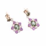 A PAIR OF TOURMALINE, PINK SAPPHIRE AND DIAMOND PENDANT EARRINGS each surmounted claw-set with a