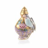 A CHINESE FAMILLE ROSE SNUFF BOTTLE moulded with a parrot resting on a woven basket issuing a pink