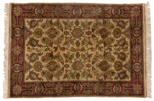 AN INDO-PERSIAN RUG, MODERN the ivory field with an overall design, multi-coloured palmettes with