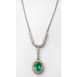 AN EMERALD AND DIAMOND PENDANT centred with an oval mixed-cut emerald weighing 1.68cts, within a
