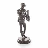 A BRONZE SCULPTURE OF A LYRE PLAYER the figure adorned with a wreath on his head and Roman