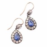 A PAIR OF SAPPHIRE AND DIAMOND PENDANT EARRINGS each surmount bezel-set with and old-cut diamond,
